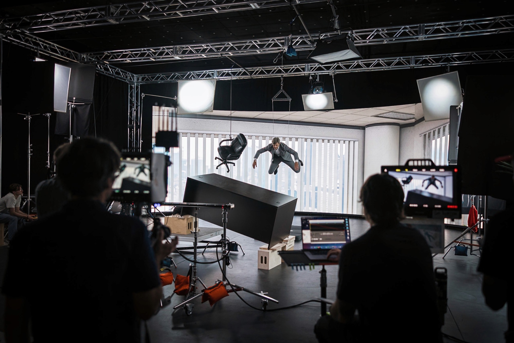 Crew watching monitors during a shoot on the stage